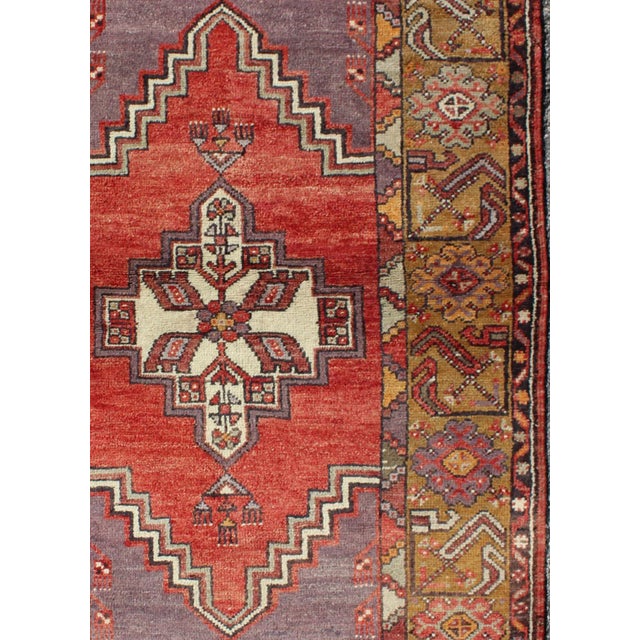 Geometric Vintage Turkish Oushak Carpet in soft Red, Light Purple, & Gold Border Measures: 3'5 x 5 Oushak Vintage...