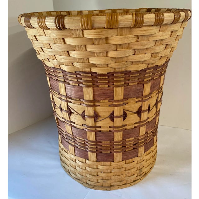 Really nice vintage tall basket could be used as a waste basket or even to put a plant in. Nice sturdy wood bottom and...