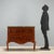 Late Baroque chest of drawers in walnut and walnut burl. Curved front with two drawers, as are the sides. Curved legs...