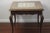 Lovely little vintage table with four square tile top. Beautiful Early California patterned tile features shades of blue,...