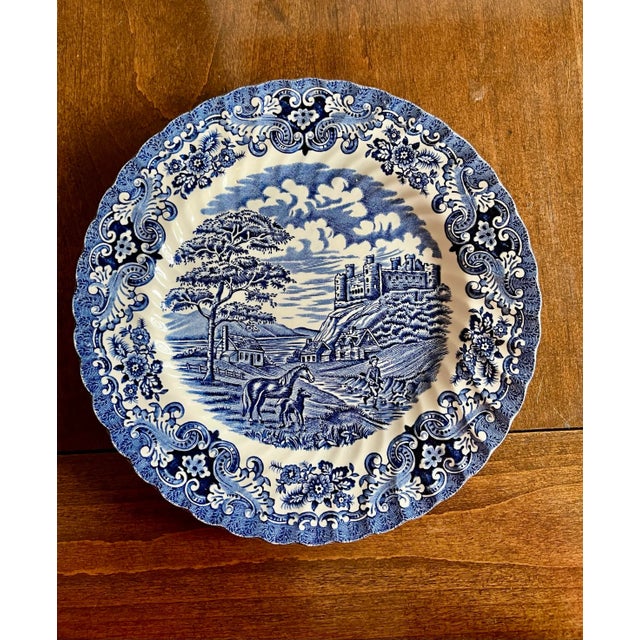 This beautiful traditional English ironstone hand engraved blue and white plate depicting an old country castle. Some...