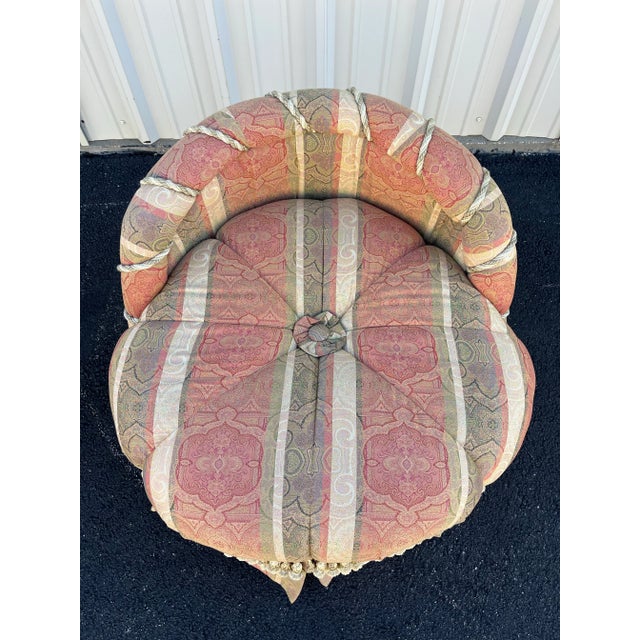 A beautiful take on a French style tub chair. Early 20th century striped upholstery covers this changing pouf or bedroom...