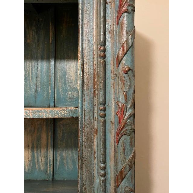 Beautiful light blue/turquoise with worn reddish accent points. Very sturdy/heavy. Great for clothing storage/ mixed use...