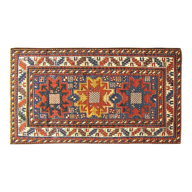 Antique Caucasian Kazak Oriental Rug with Starburst Design & Blue Field For Sale