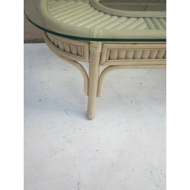 The Wash Wood Bamboo End Table Glass features a bamboo material construction with a glass tabletop. The end table has...