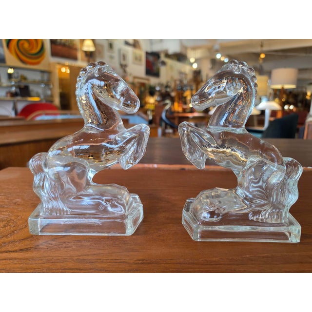 Mid-Century Clear Molded Glass Rearing Horse Bookends / Figurines - Pair ​Add a touch of classic mid-century elegance and...