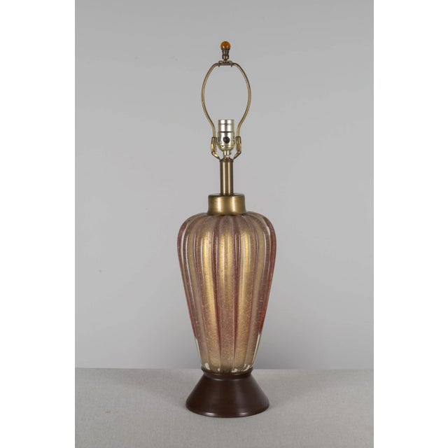A rare mid-century modern Murano glass table lamp made by the renowned Italian glass maker Seguso. Thick hand-blown cased...