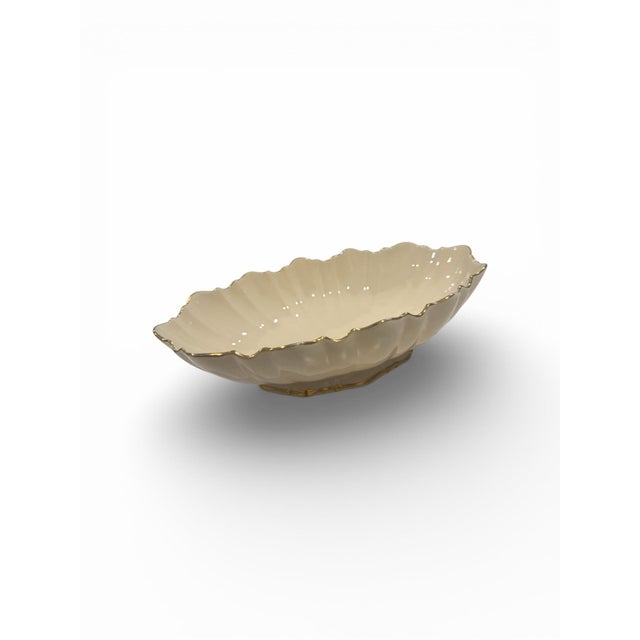 This item is a Lenox Symphony Gold Trim Oval Scallop Footed Serving Bowl, featuring ivory porcelain and 24k gold trim. *...