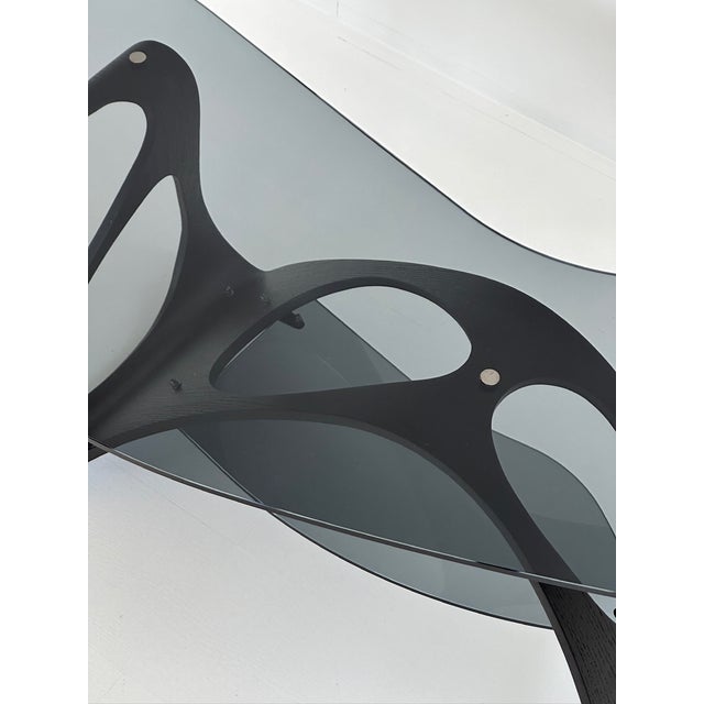 Arabesco cm is one of carlo mollino's most famous, imaginative, and emblematic creations: a modern coffee table imbued...