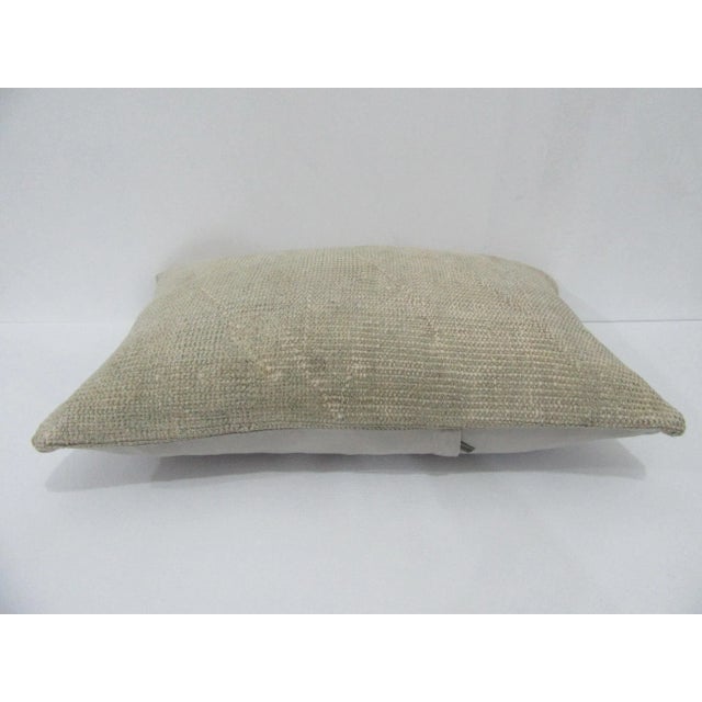 Decorative pillow cover made from a vintage Turkish handknotted rug. Backed with good quality cotton fabric. Pillow...