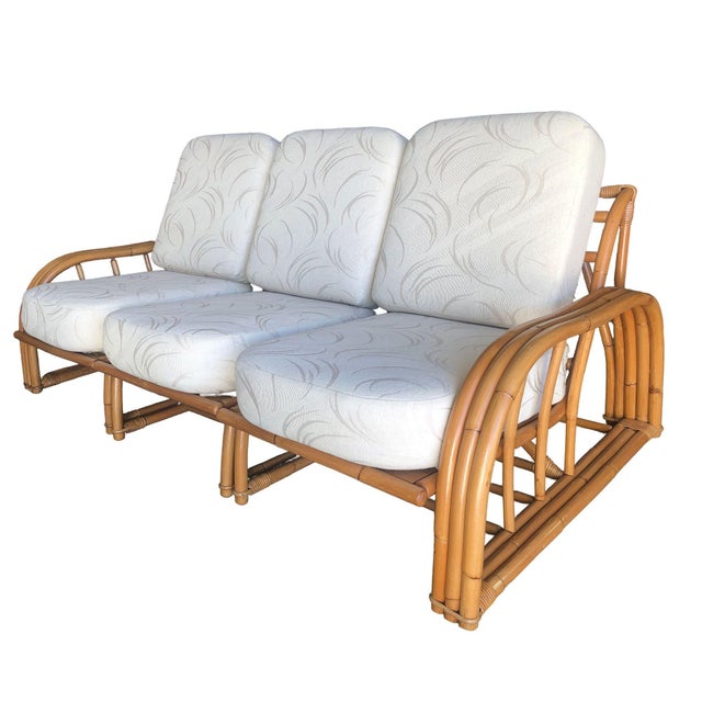 This restored Paul László rattan sectional three-seat sofa features a sleek, minimalist design that blends natural rattan...