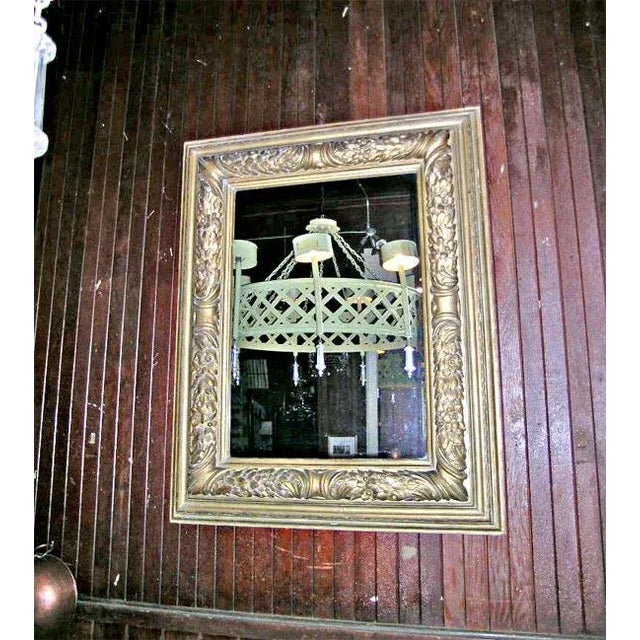 Gilt carved wood framed mirror. Mirror is newer.
