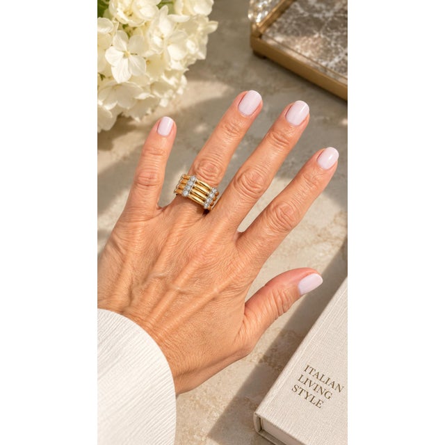 Strong mid-century design with real presence. This 1960s ring by Trio is crafted in 18K yellow and white gold, featuring...