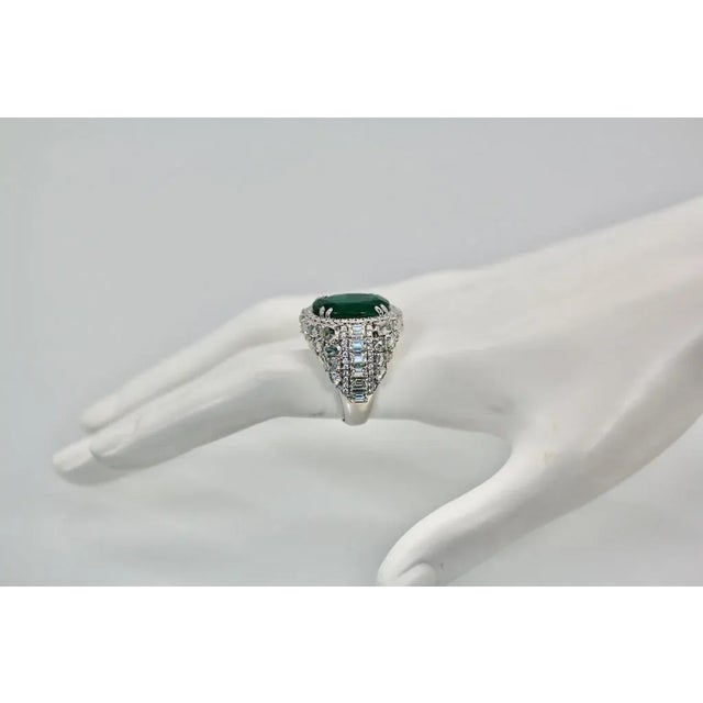 This is part of Chairish’s Fine Jewelry assortment. Oval Emerald 12.25 Carat Diamond Surround 8.85 Carat Total Weight...