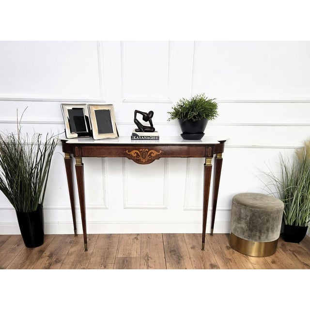 Very elegant and refined Italian 1950s Mid-Century Modern and Neoclassical design console table highlighted by the great...
