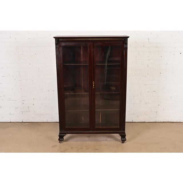 A gorgeous antique American Empire or Victorian bookcase cabinet In the manner of R.J. Horner & Co. USA, Circa 1890s...