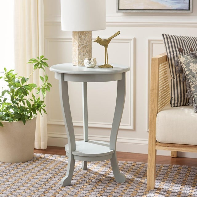 The Mary Pedestal Side Table, crafted of pine with a robins egg finish, is the perfect accent for any room in need of a...