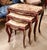 Elegant Rococo style nesting tables featuring a luxurious set of three accent tables topped with sophisticated beige and...