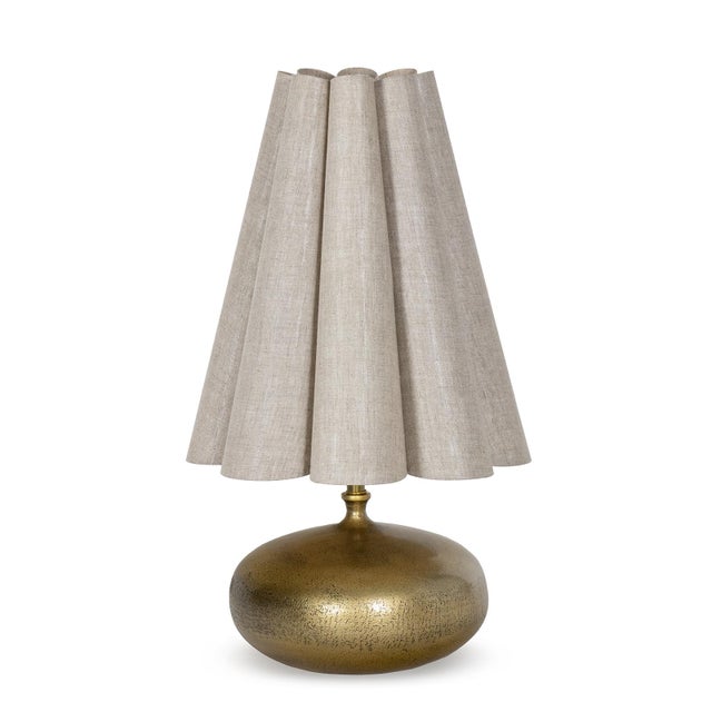The Cassidy Mini Lamp pairs a compact form with a confident presence. Its sculptural orb base, cast in metal and finished...