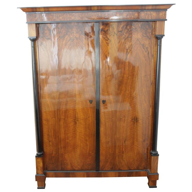 Beautiful early Biedermeier Armoire from Austria, circa 1820. This two-door neoclassical armoire or wardrobe has a...