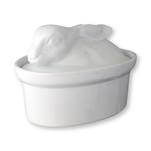 Charming white French porcelain rabbit tureen with molded detail and glossy glaze. Likely mid-20th century, this lidded...
