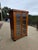 Great looking early 19th display Cabinet with upholstered interior. This appears to be a fruitwood and has some ebonized...