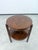 Elevate your space with this exquisite Art Deco / Functionalist round side table with an integrated lower shelf,...