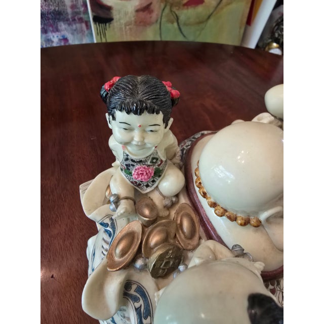 A fine large vintage Hollywood Glamour sculpture of a Buddha riding a bull carriage artist signed. Having tremendous...