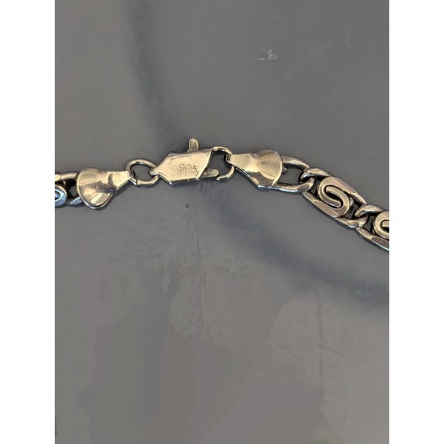 Stamped 925, superior compact construction, it weighs apx 1.25 ounces. Nice length.