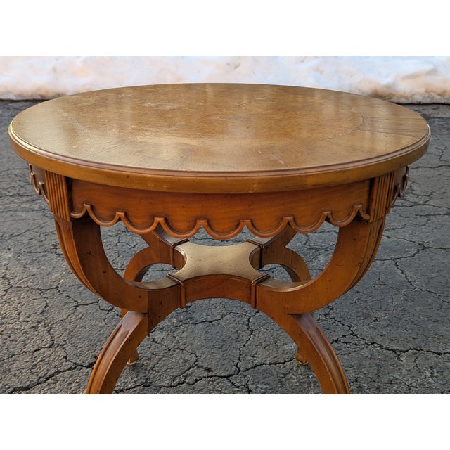 Elevate your interior with this sophisticated Vintage John Widdicomb Round Fruitwood Side Table, a masterclass in mid-...