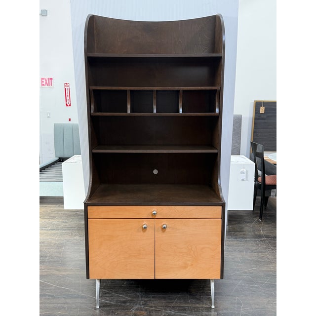 Design Plus Gallery presents a Bespoke Mid-Century Style Cabinet. This custom cabinet showcases a two-tone wood design...
