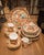 A beautiful Mid-Century Arita Imari Peacock China Set with full dinner service for four. The set includes: Serving Pieces...