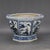 This elegant porcelain planter features an octagonal form with a flared rim, resting upon a matching pedestal base. The...