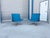 This pair of Mid-Century Modern swivel lounge chairs by Vika combines sleek Scandinavian-inspired design with a bold two-...