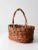 This is a vintage wicker basket. The woven basket features a top handle and wood base. A classic harvest basket thats...