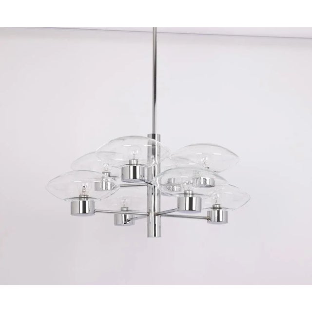 Midcentury vintage chrome pendant made by kaiser leuchten, germany with 12 clear glass shades. High quality and in very...