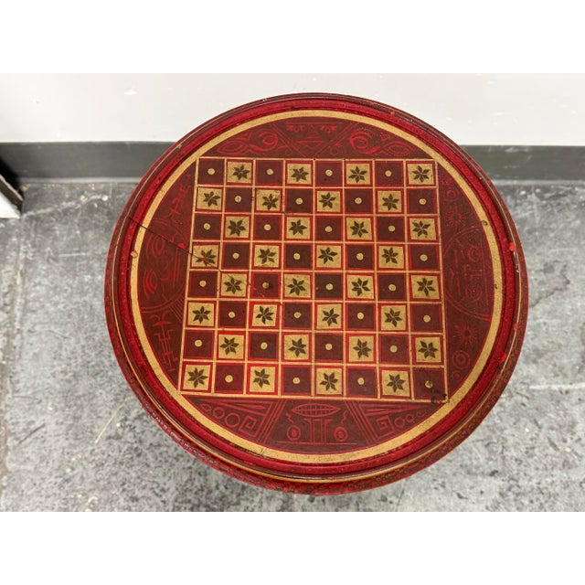 Design Plus Gallery presents a Vintage Hand-Painted Round Pedestal Game Table. This round pedestal table has a red, gold,...