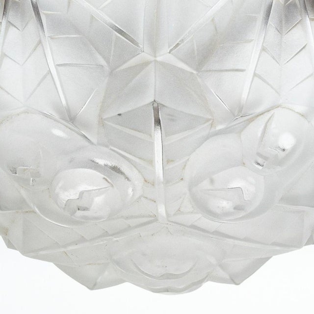 Art Deco Frosted Glass Chandelier, with chrome hardware and six light bulb fittings. 19" H x 13.75" Diameter. Provenance:...