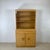 An exceptional example of American mid-century organic modernism, this two-piece china cabinet and hutch from Heywood-...