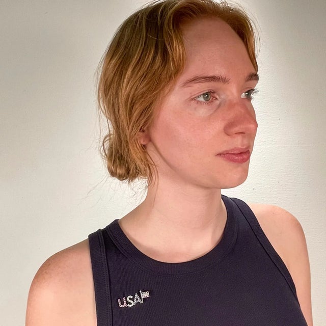 A fine patriotic pin or brooch. In 18k white gold. Depicting an American flag to the right and the letters 'USA' to the...