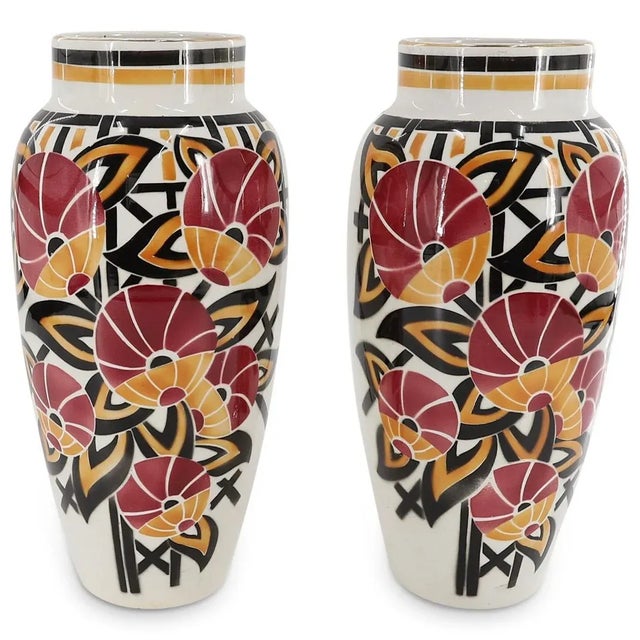 Matching set of Luneville glazed vases. Each decorated with floral and foliage motifs and geometric designs. Finished with...