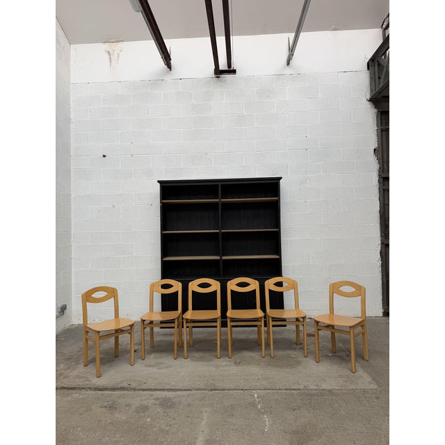 This set of light beech chairs from the 1980s is in good overall condition. Their simple design and openwork backrest make...
