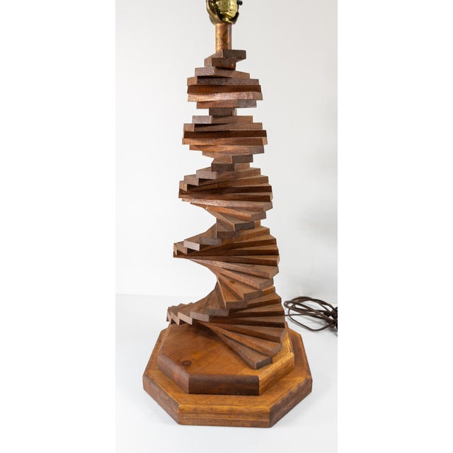 We are selling this great mid-century modern wood spiral hand made table lamp. The lamp probably dates to the 1950s or 60s...