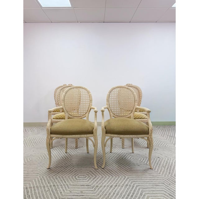 Bring effortless coastal charm to your dining space with this set of 6 vintage cane dining chairs in a warm beige tones....