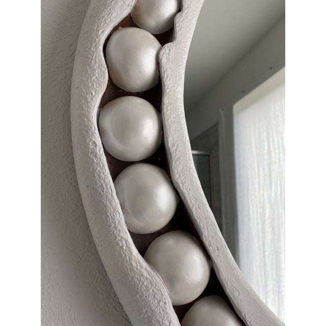 Like a piece of jewelry for a room, the Pearl Round Mirror clasps its string of beads in circular fashion as if it is...