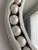 Like a piece of jewelry for a room, the Pearl Round Mirror clasps its string of beads in circular fashion as if it is...