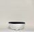 A bold meditation in contrast, this bowl merges tactile imperfection with architectural elegance. Carved with intention,...
