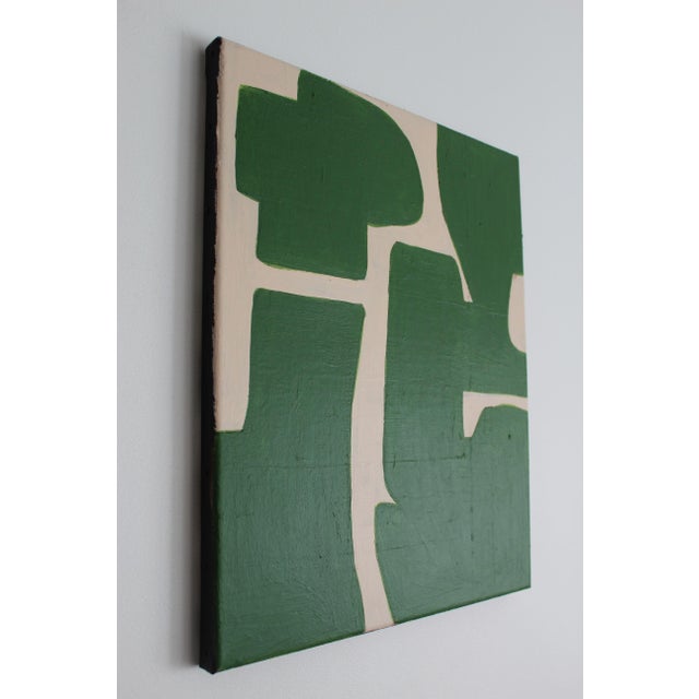 Introducing the Organic Green Abstract 2. The green shapes stand out against a soft, light beige background, creating a...
