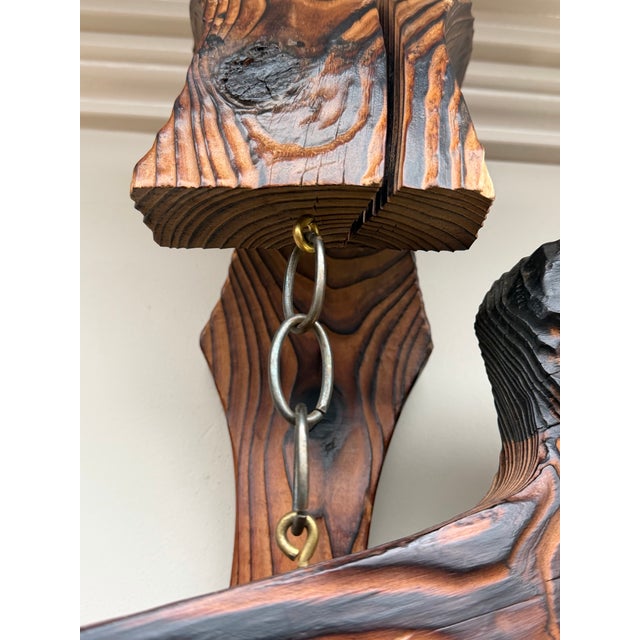 A striking example of mid-20th century American tiki design, this vintage Witco carved wooden scimitar wall sculpture...
