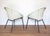 A strikingly attractive and rare pair of mid-century satellite cocktail chairs in lovely vintage condition. Made by the...